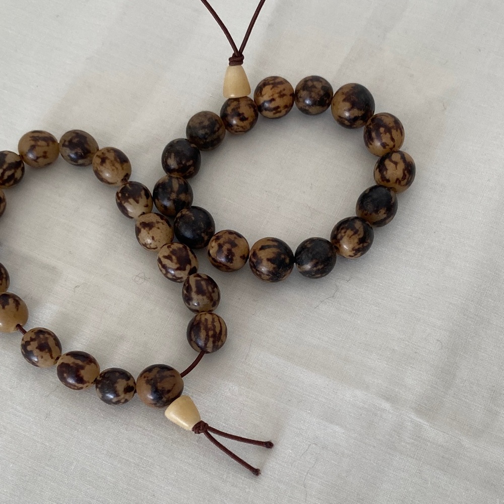 Hand pick Buri seed beads from Asia